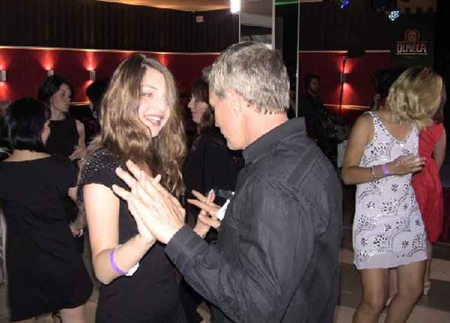 A photo of a European woman and Western man dancing at one of our socials